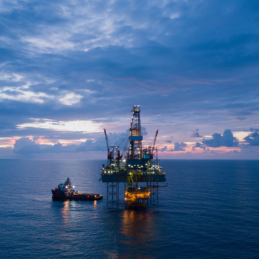 Aerial view offshore drilling rig at the offshore location during sunset