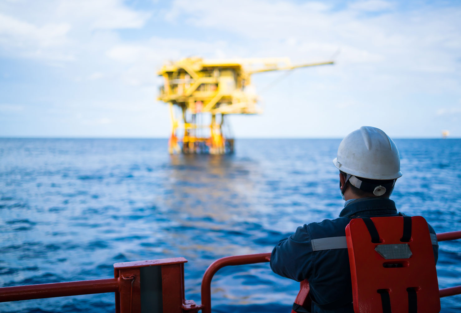 Engineer looking at Offshore oil and gas wellhead remote platform