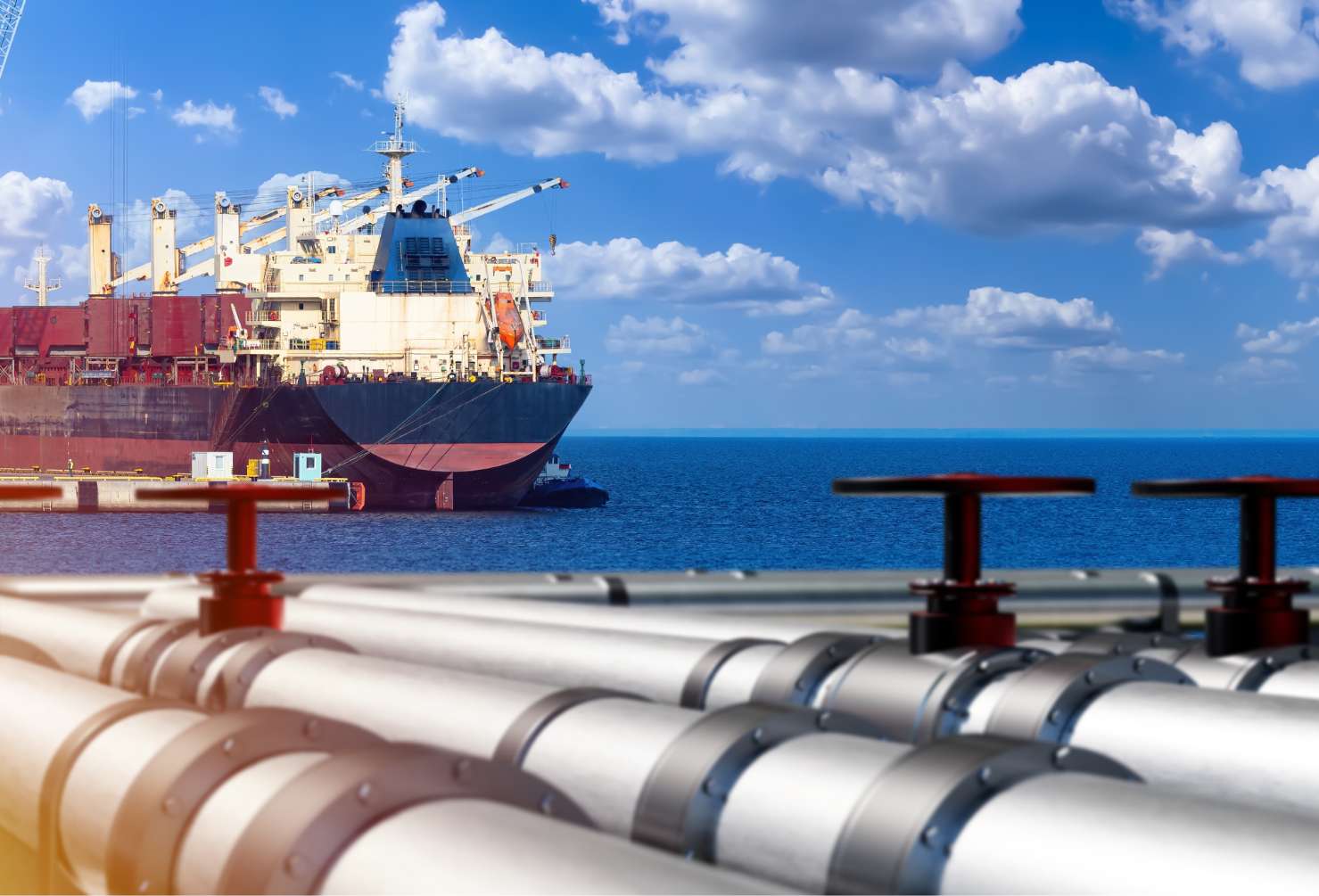 The Scarborough Effect: How One Project Is Reshaping WA’s Energy Workforce LNG terminal in port. Ship near gas pipes. Harbor for loading LNG onto sea vessel. Port for transportation oil. Gas LNG pipeline. Import of methane and propane. Export of petroleum products by ship